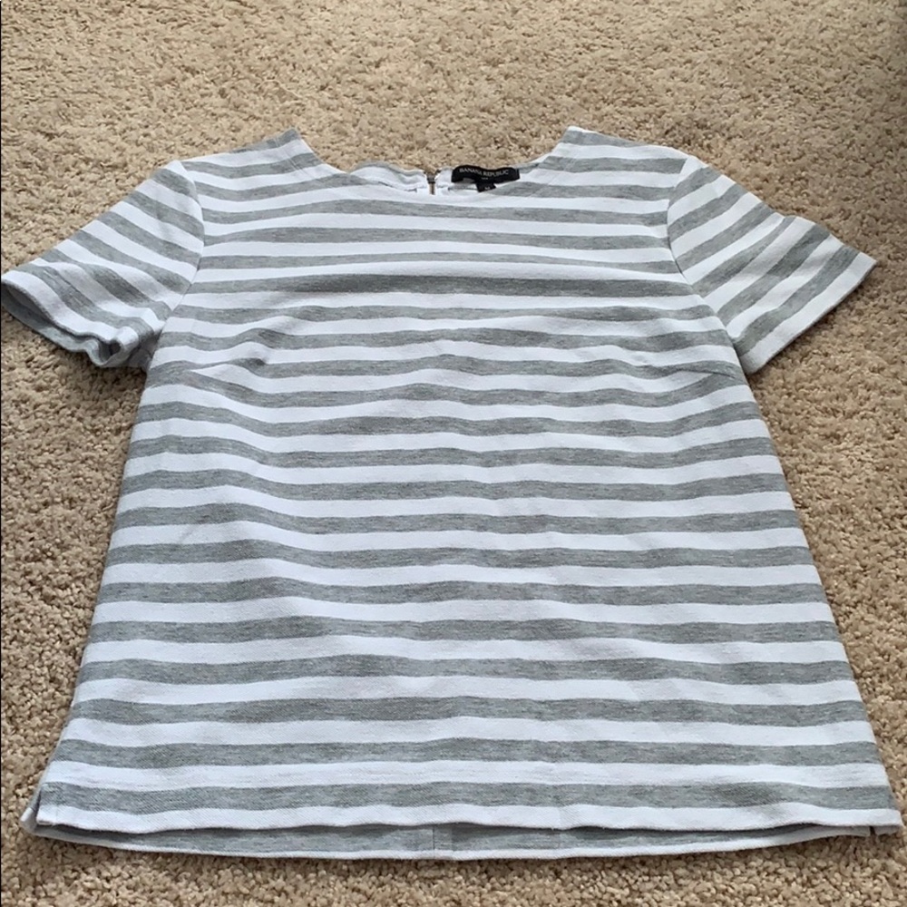 White and gray striped top.